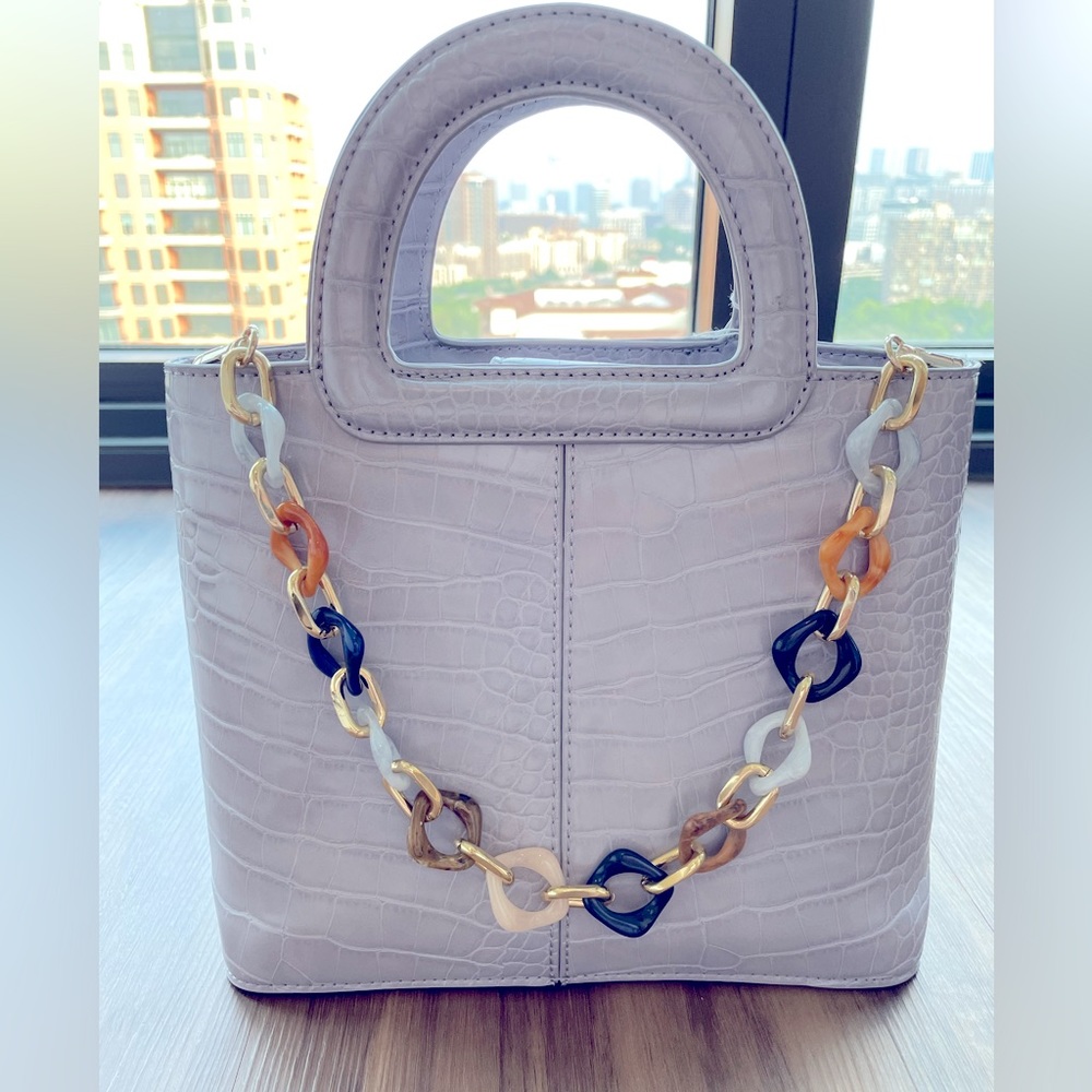 Topshop mini light purple crocodile textured handbag.